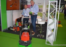 Dany Mestdag holds the batery of the E Geotec pro. Of course, the E stands for elictrical, so this Geotec is perfect for the greenhouse. Next to Dany, Patrick Germaey of Terrazza MC.  https://www.hortidaily.com/article/9537939/a-machine-for-cleaning-coverings-with-geotextiles/